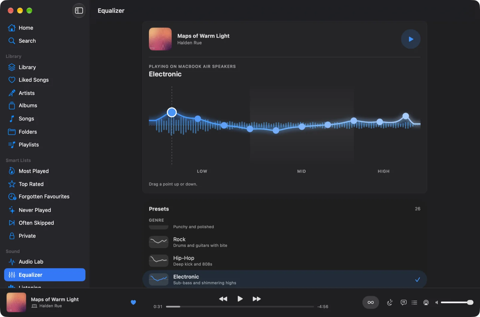 The equalizer on Mac: the drawn curve over live levels, playing on the MacBook Air speakers, with presets below